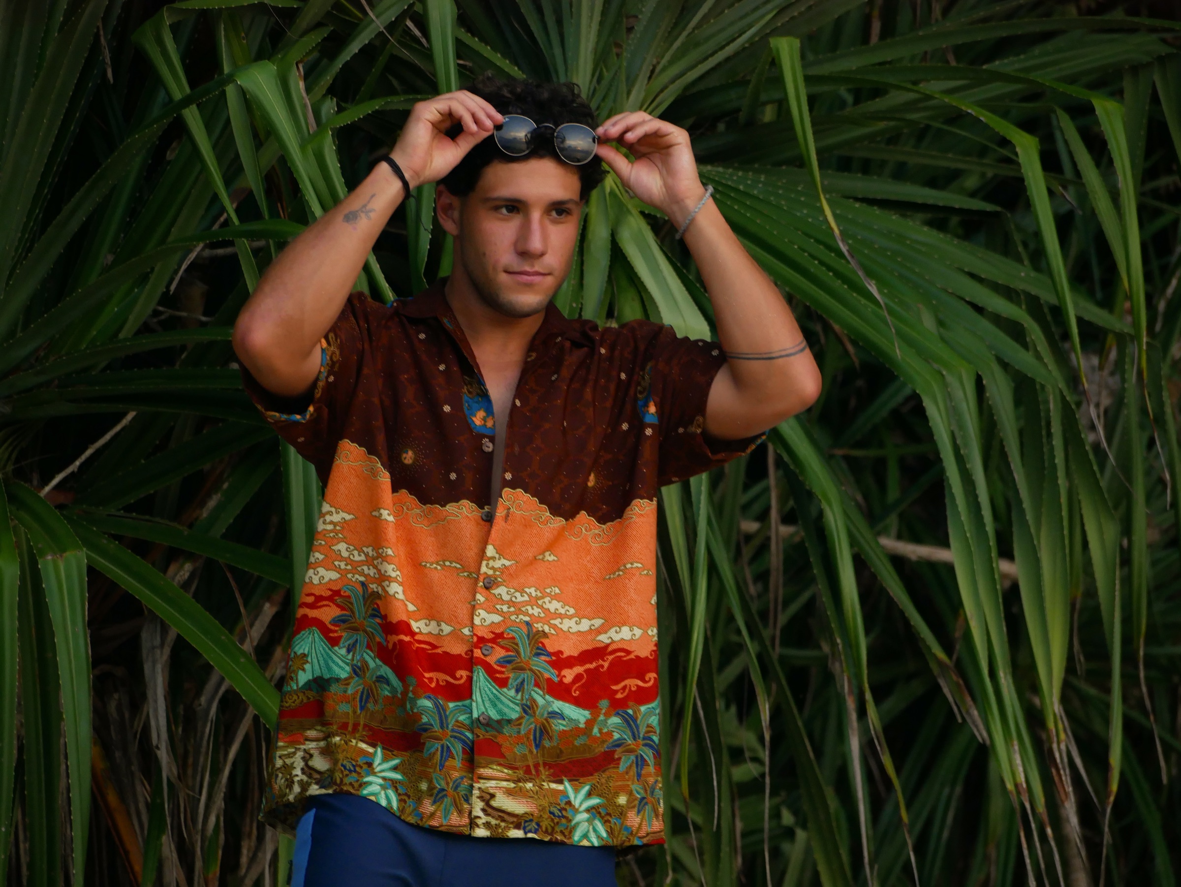 Model wearing an Ulu Life short-sleeve batik shirt in Bali